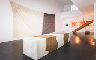 Fondazione Mudima, Milano, Maggio 2015, K. Enokura - K. Enokoura - Untitled, 1970/1995, cemento, pelle 72x254x70 cm. K. Enokura - Untitled, 1995, olio per motore usato su tela, 370x560 cm. © Foto di Fabio Mantegna per Fondazione Mudima